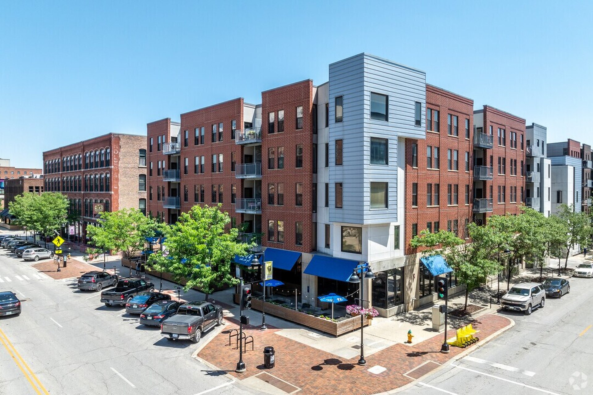 The Market Place Lofts corner building on Court Avenue, with restaurants and outdoor seating at street level