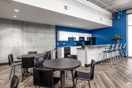 The community room with a kitchenette and bar seating