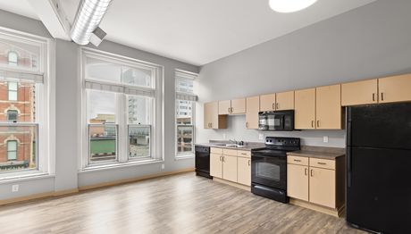A kitchen with a downtown Des Moines skyline view