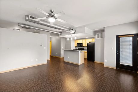 An open living room and kitchen near the unit's front entry