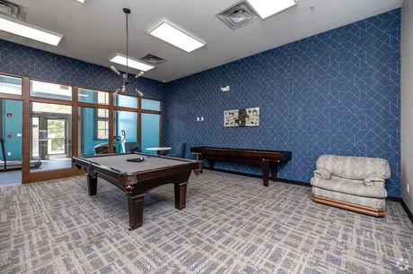 The resident lounge with a pool table and seating