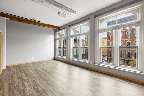 A unit's windows overlooking Court Avenue, with a historic brick building across the street