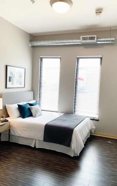 A unit's windows looking directly onto Court Avenue's historic brick buildings
